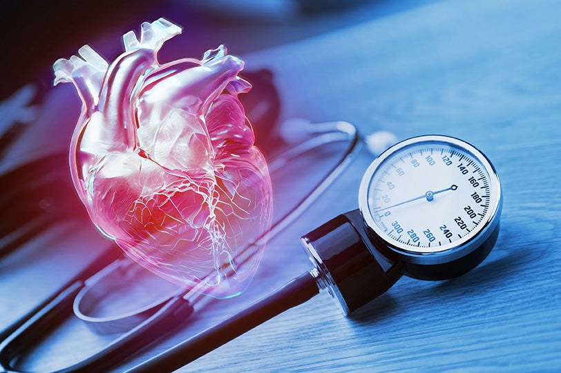 "graphic of heart next to blood pressure monitor"