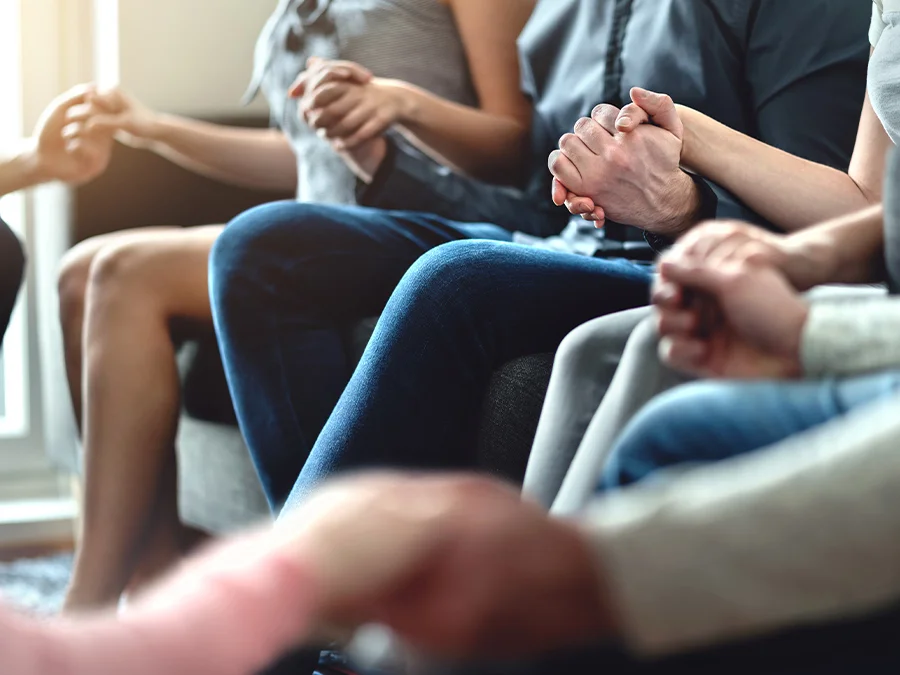 group of people holding hands