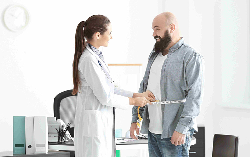 Provider measuring smiling patient