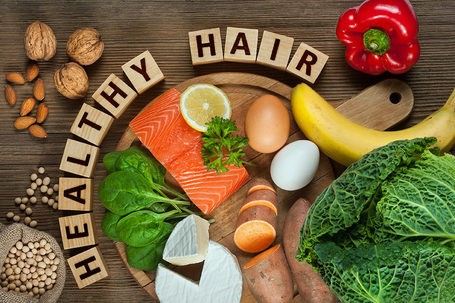 Blocks spelling "Healthy Hair" surrounded by healthy food.