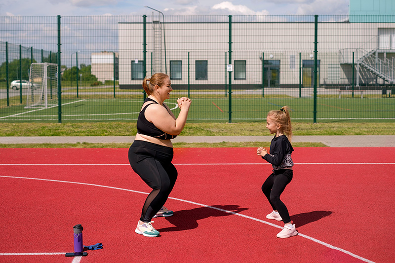 Mother and daughter exercising