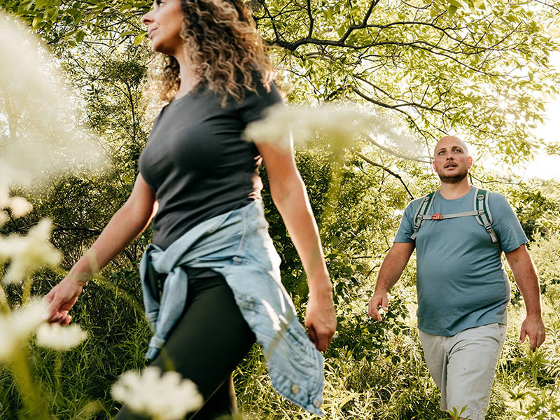 a couple hiking in the woods