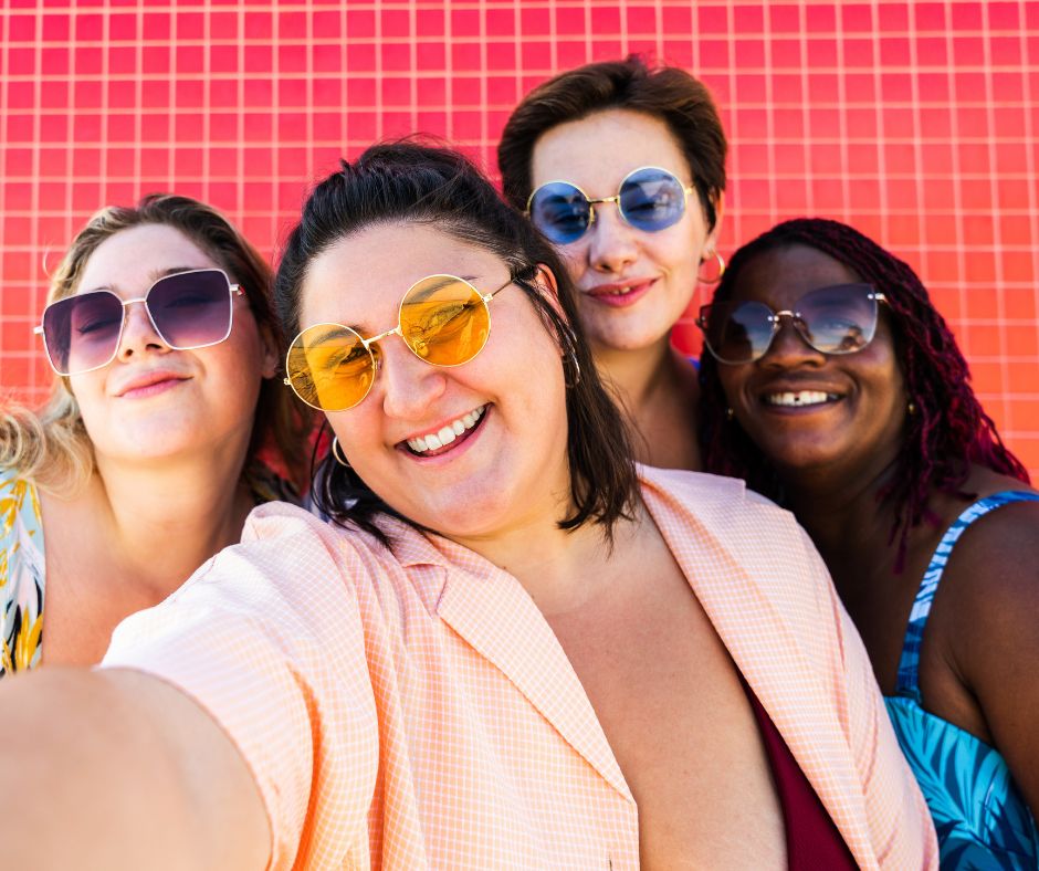 Women taking a photo with friends