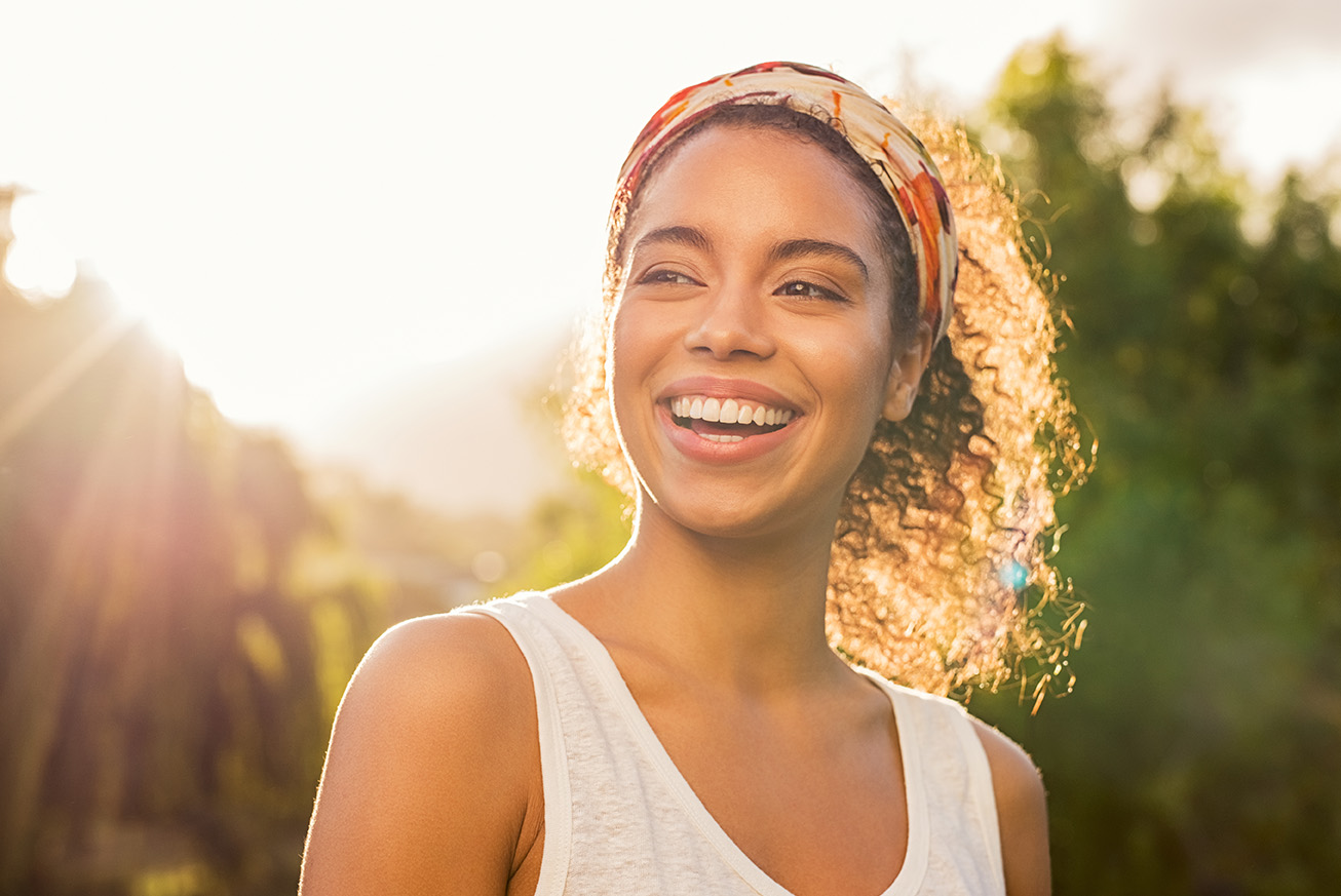 woman smiling in the sunlight