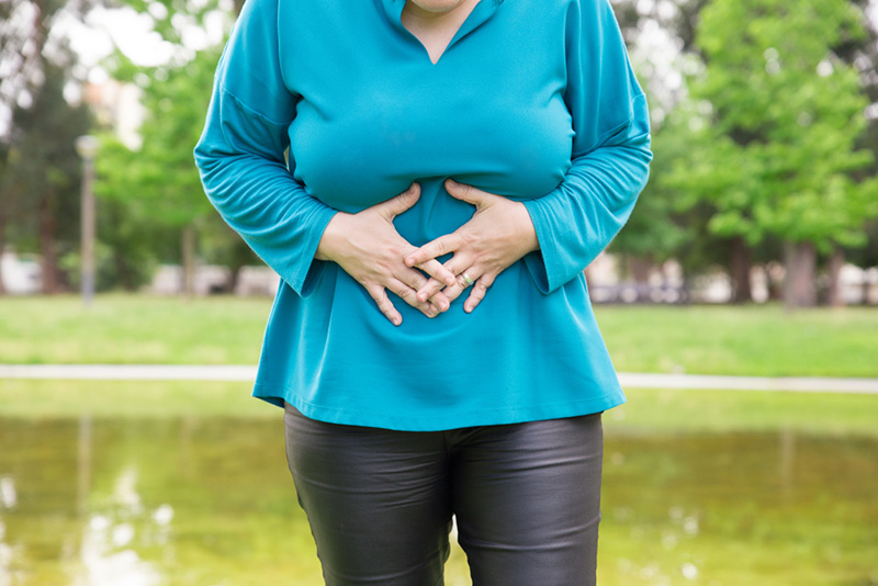 Woman holding stomach